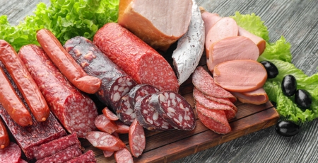 variety of deli meat on a cutting board
